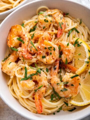 close up view of lemon garlic shrimp pasta with parsley