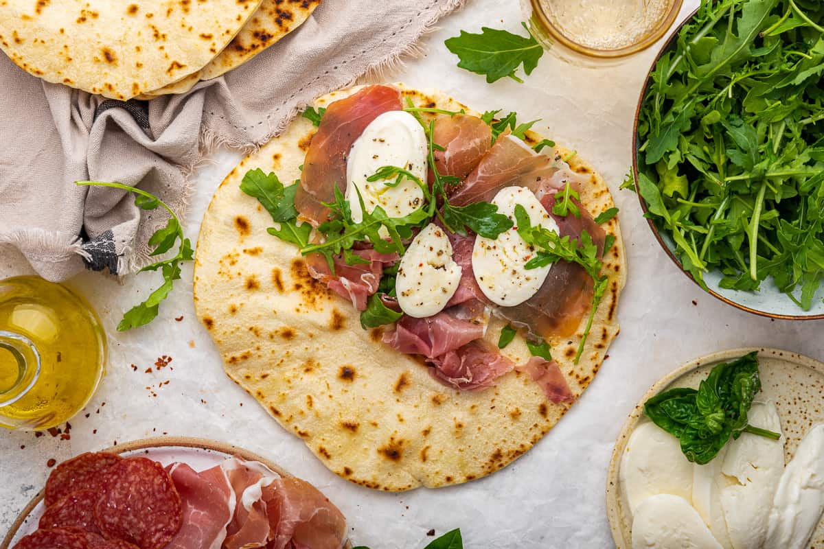 Piadina with meats and cheeses for serving. 