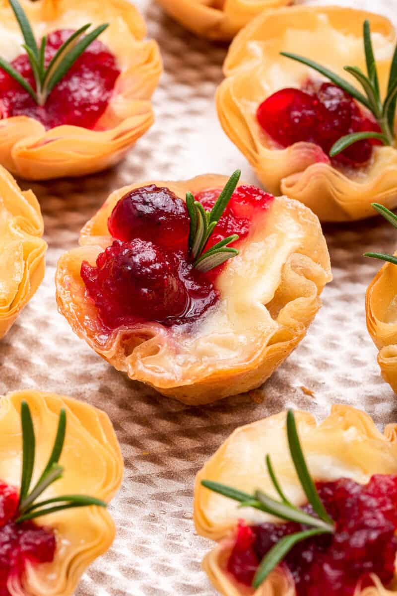 Phyllo cups with brie, cranberry, and rosemary.