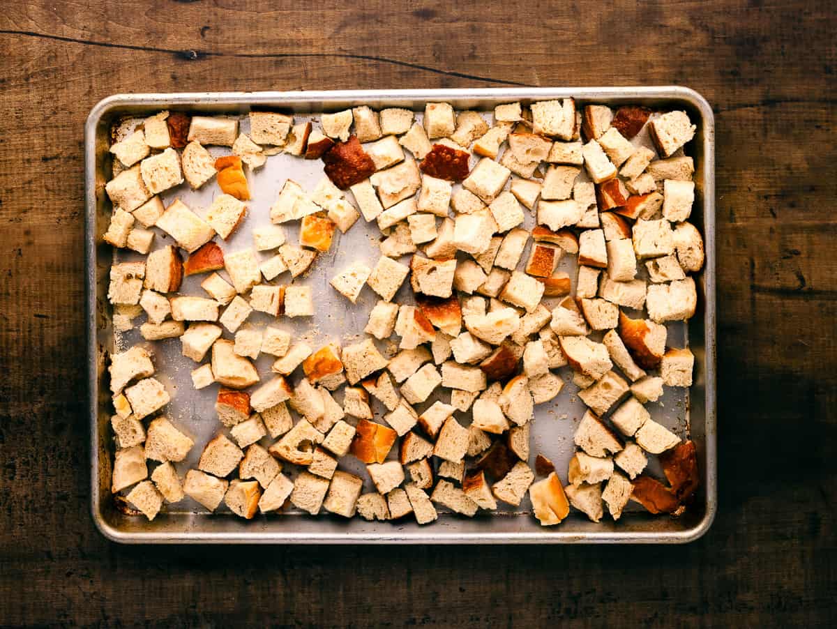 Toasting bread cubes on baking cubes.