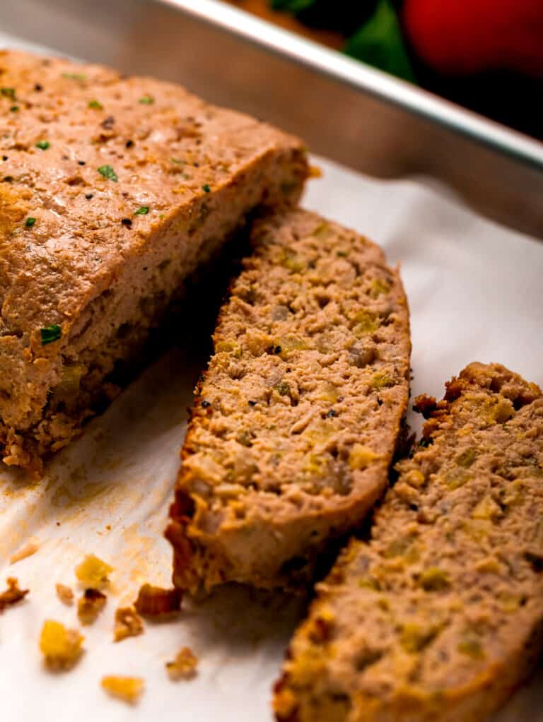 Slice of turkey meatloaf on baking sheet.