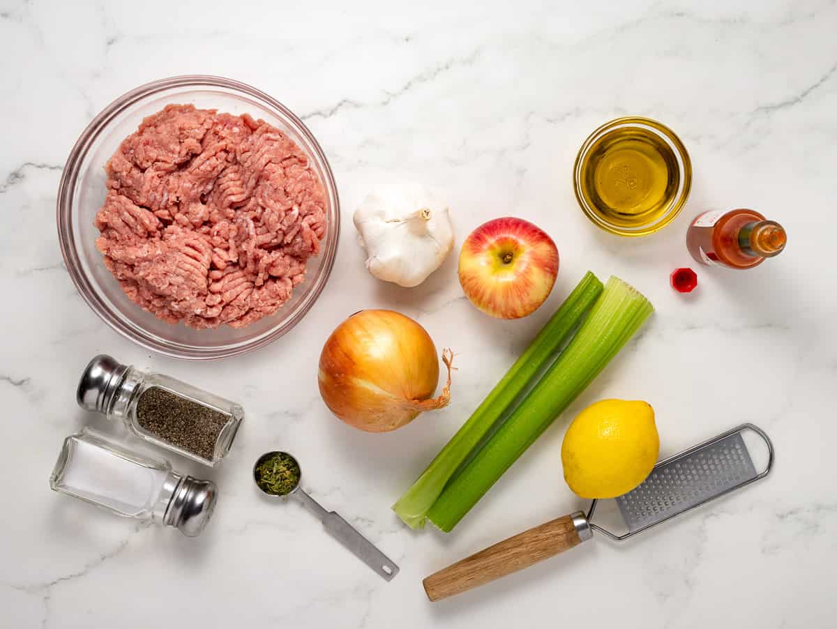 Ingredients for turkey meatloaf on white table.