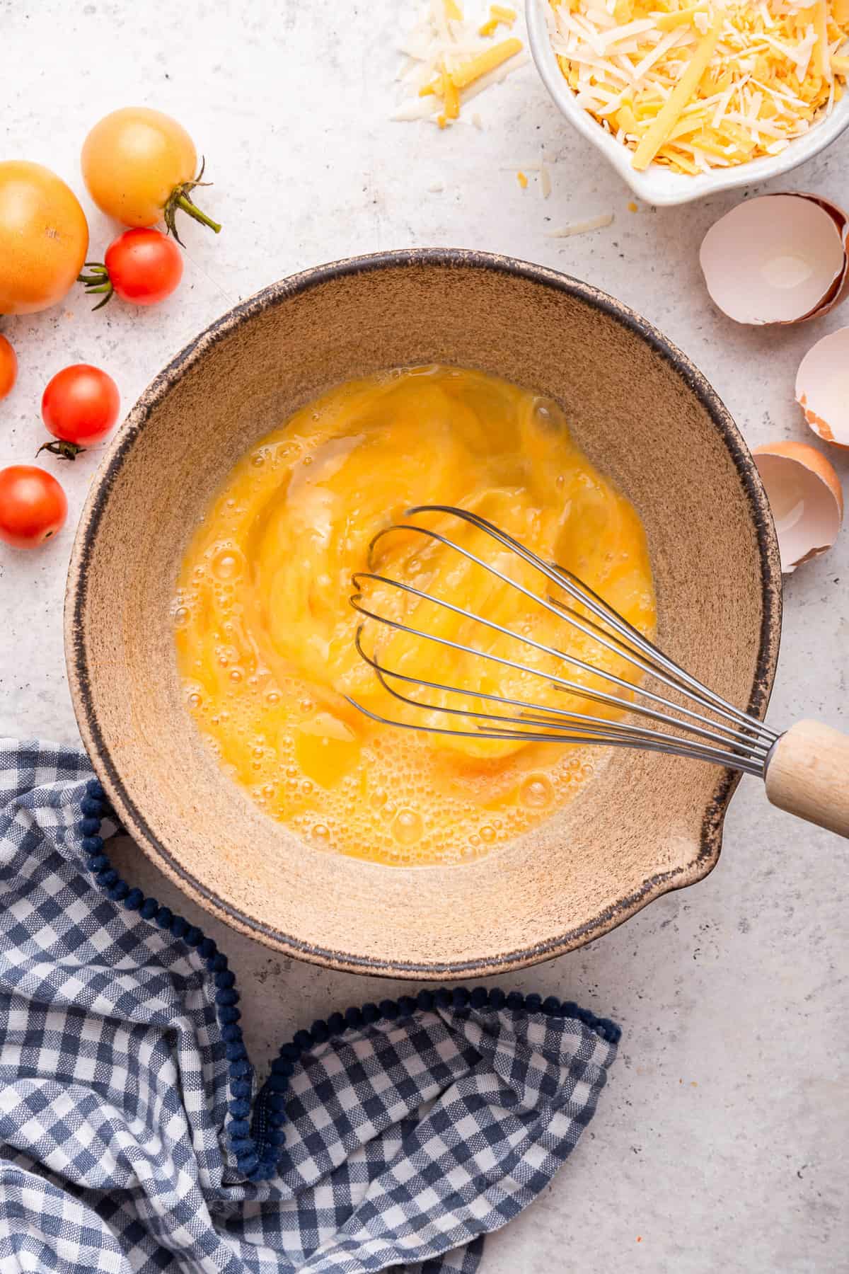 Mixing eggs in bowl. 