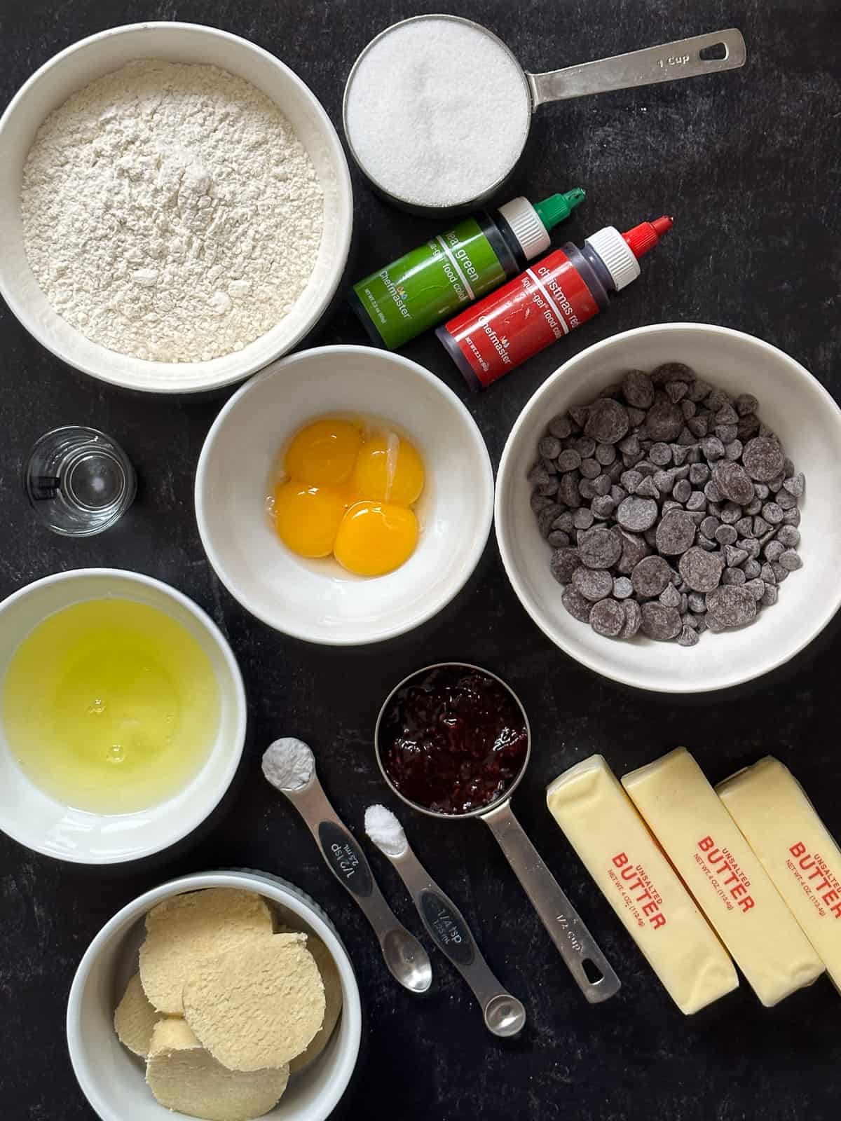 Ingredients for Italian rainbow cookies on black background.