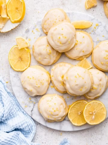 Top view of Italian lemon ricotta cookies with fresh lemon pieces.