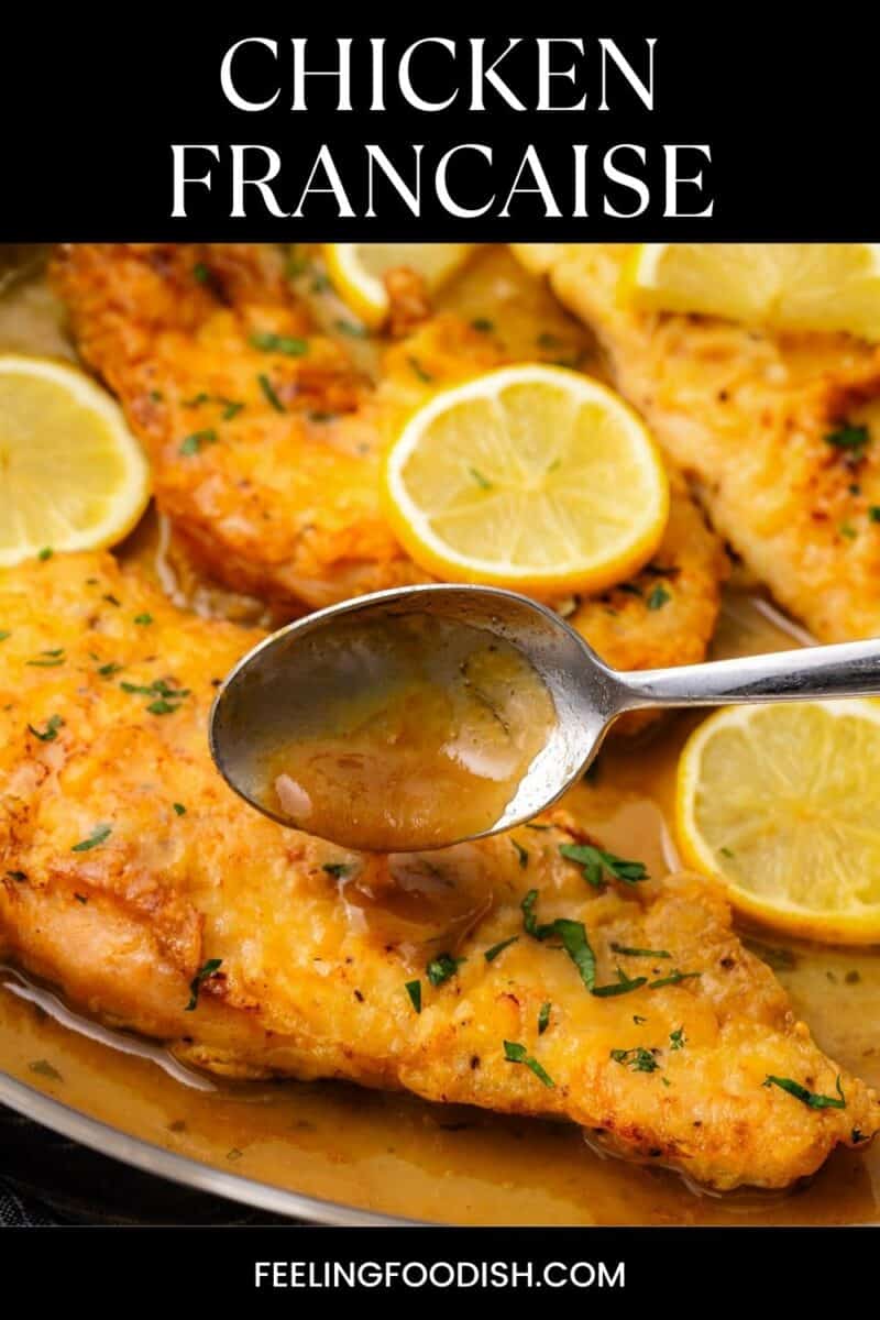 Spoon with sauce over chicken francaise.
