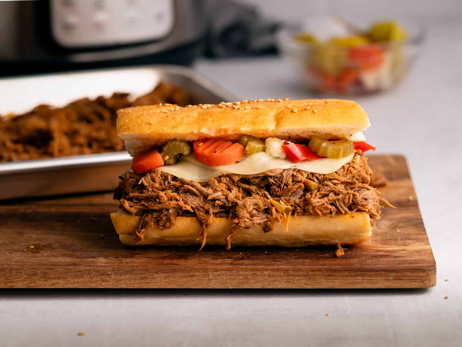 Italian beef sandwich on wooden board.