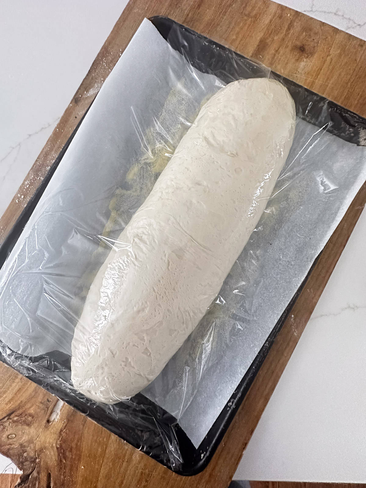 Risen loaf of Italian bread about to be baked.