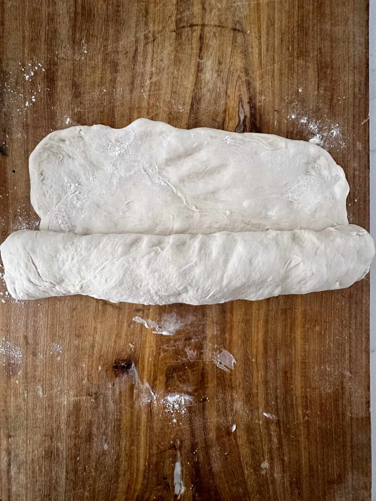 More rolling of the Italian bread dough.