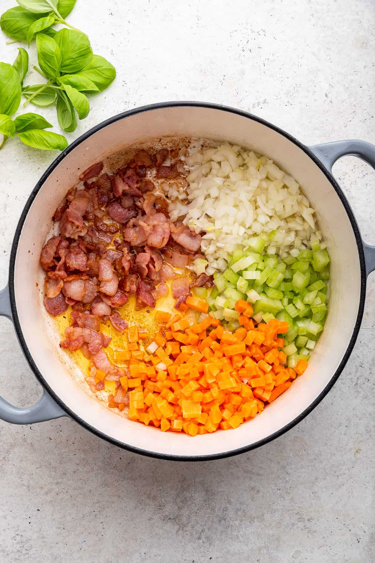 Mirapoix and bacon in pot.