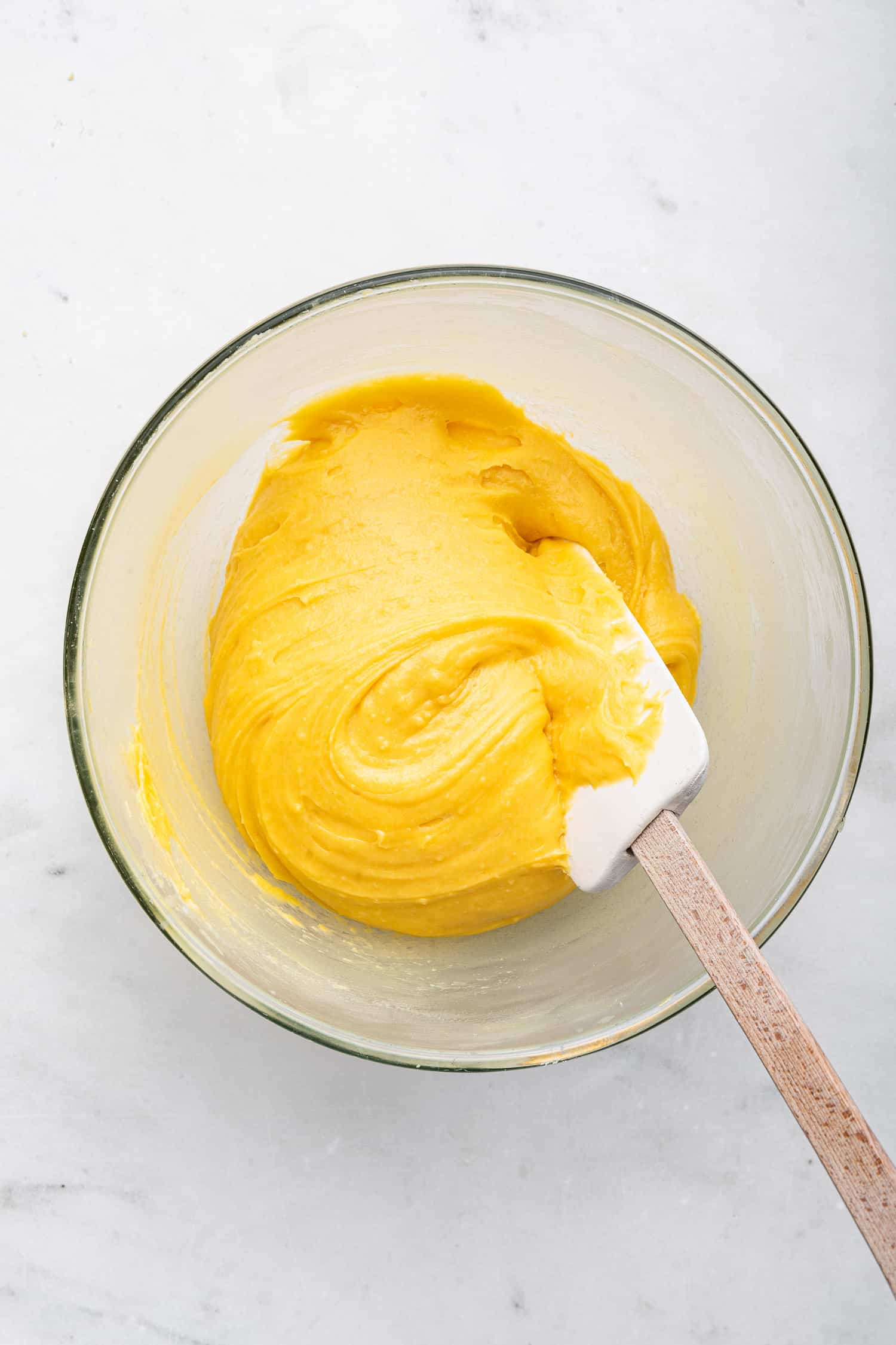 Pastry dough in a clear bowl.
