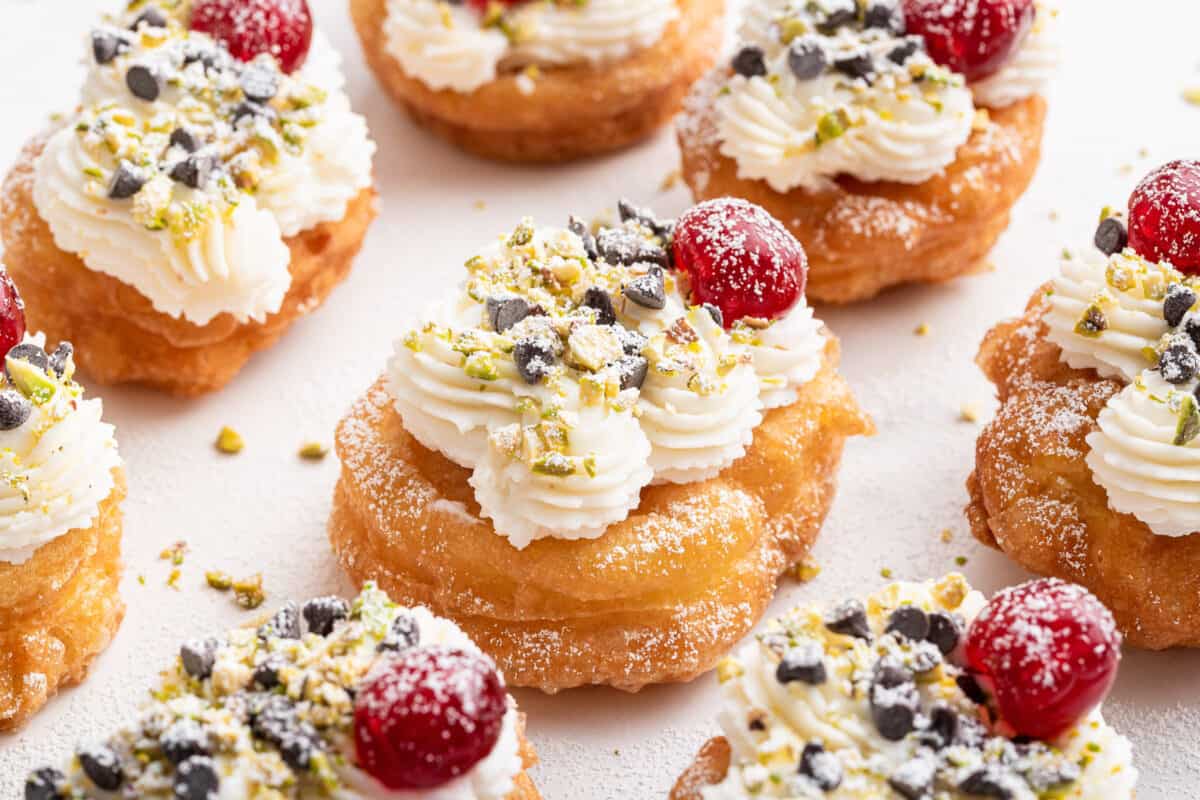 Sfingi di San Giuseppi with cannoli cream and cherry.