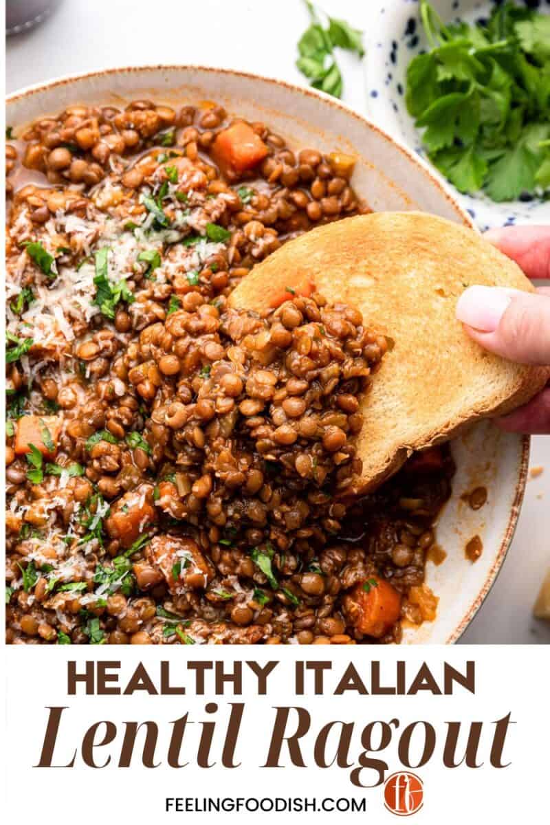 Dipping bread into Italian lentil ragout.