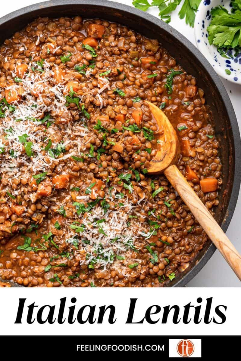 Italian lentils with wooden spoon in pot.