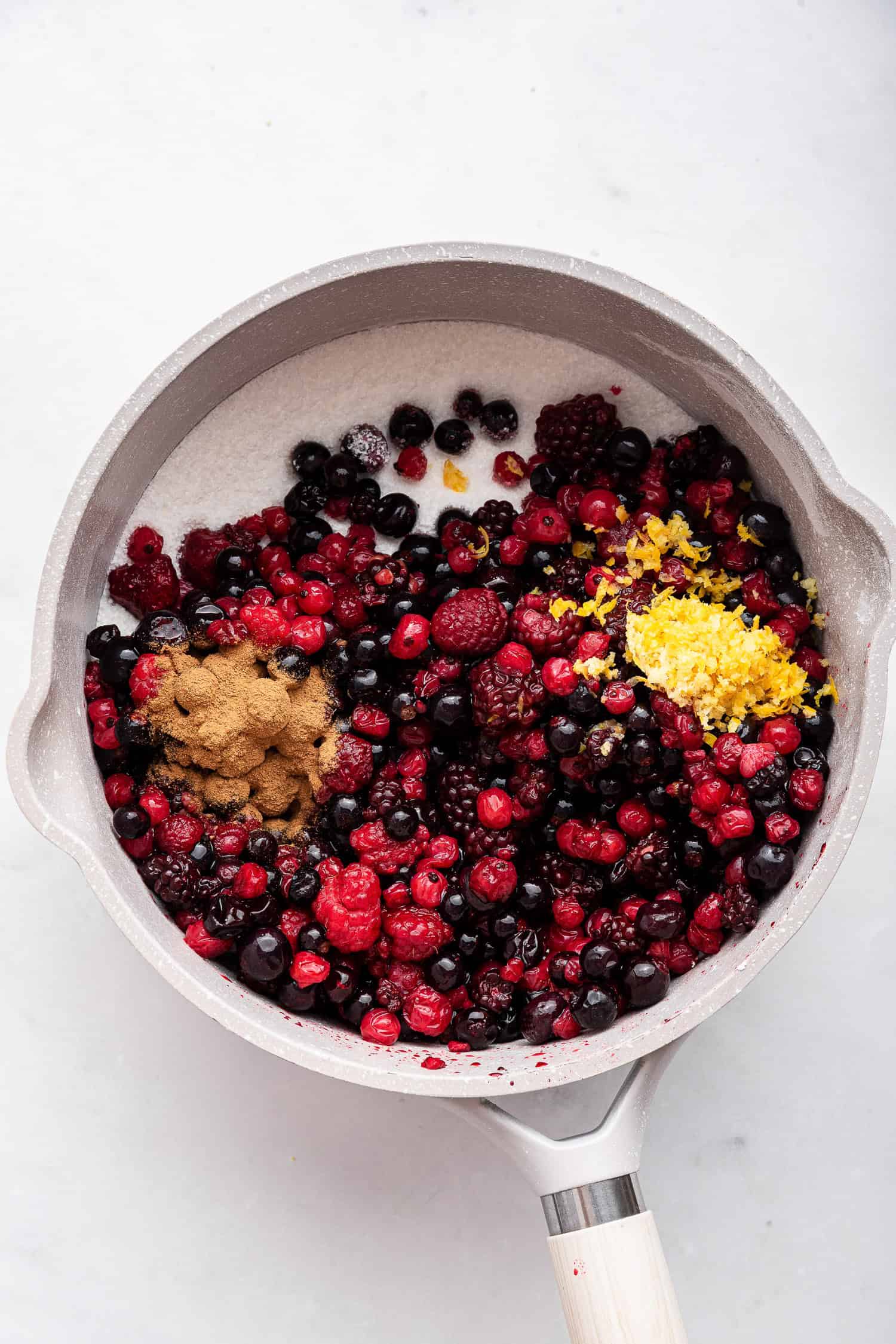 Berries and flavorings in sauce pan.