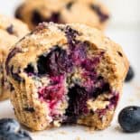 Inside of a lemon blueberry muffin on wire rack.