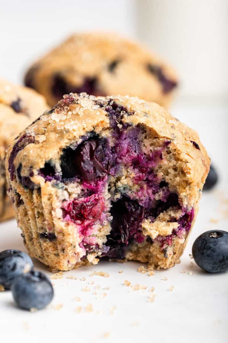 Inside of a lemon blueberry muffin on wire rack.