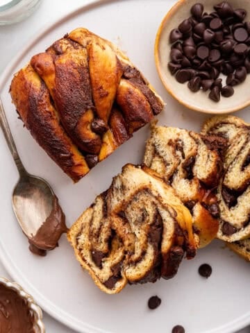 Slices of chocolate babka on white plate.