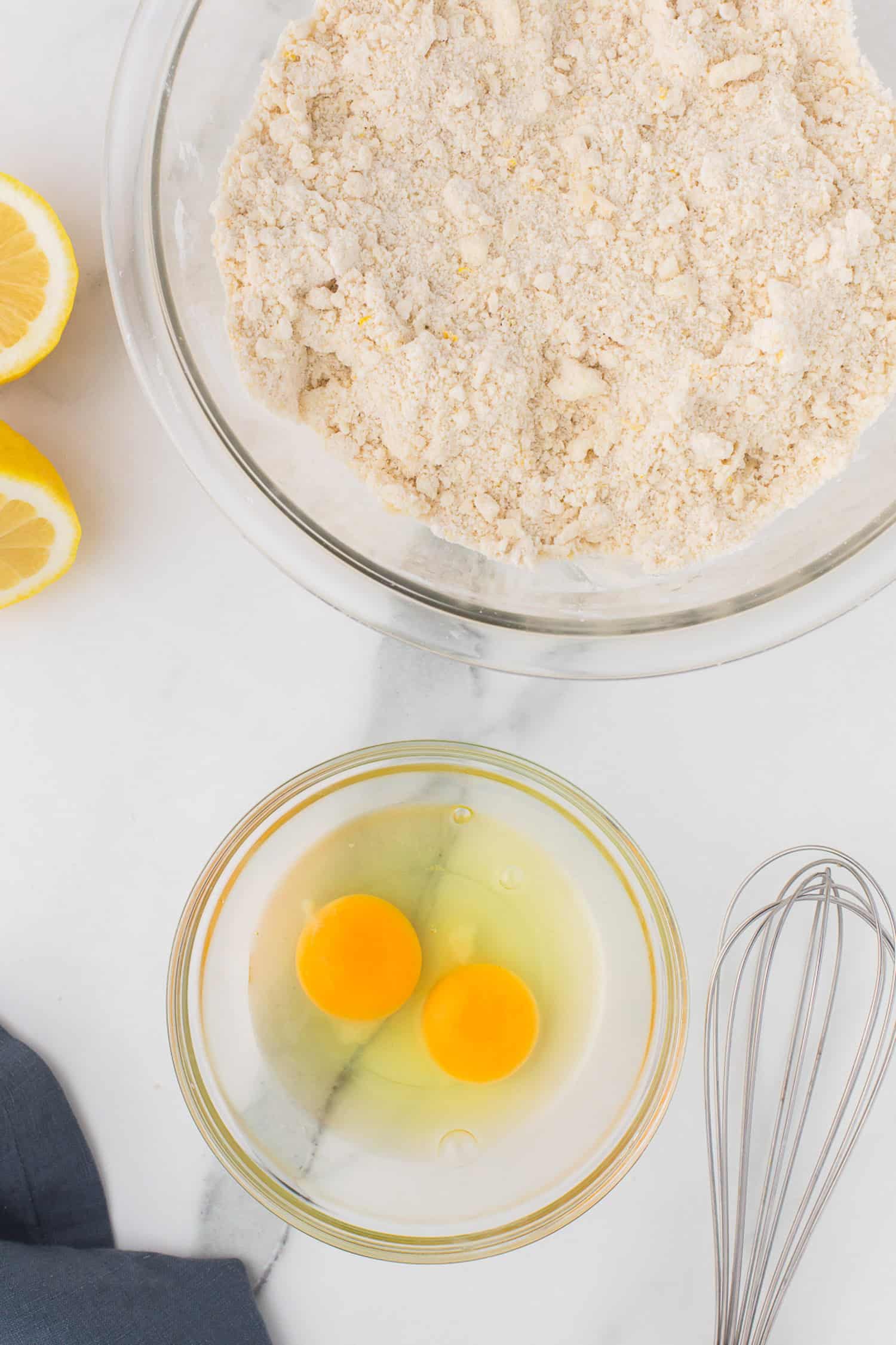 Eggs ready to mix into course crumbs for pie crust. 