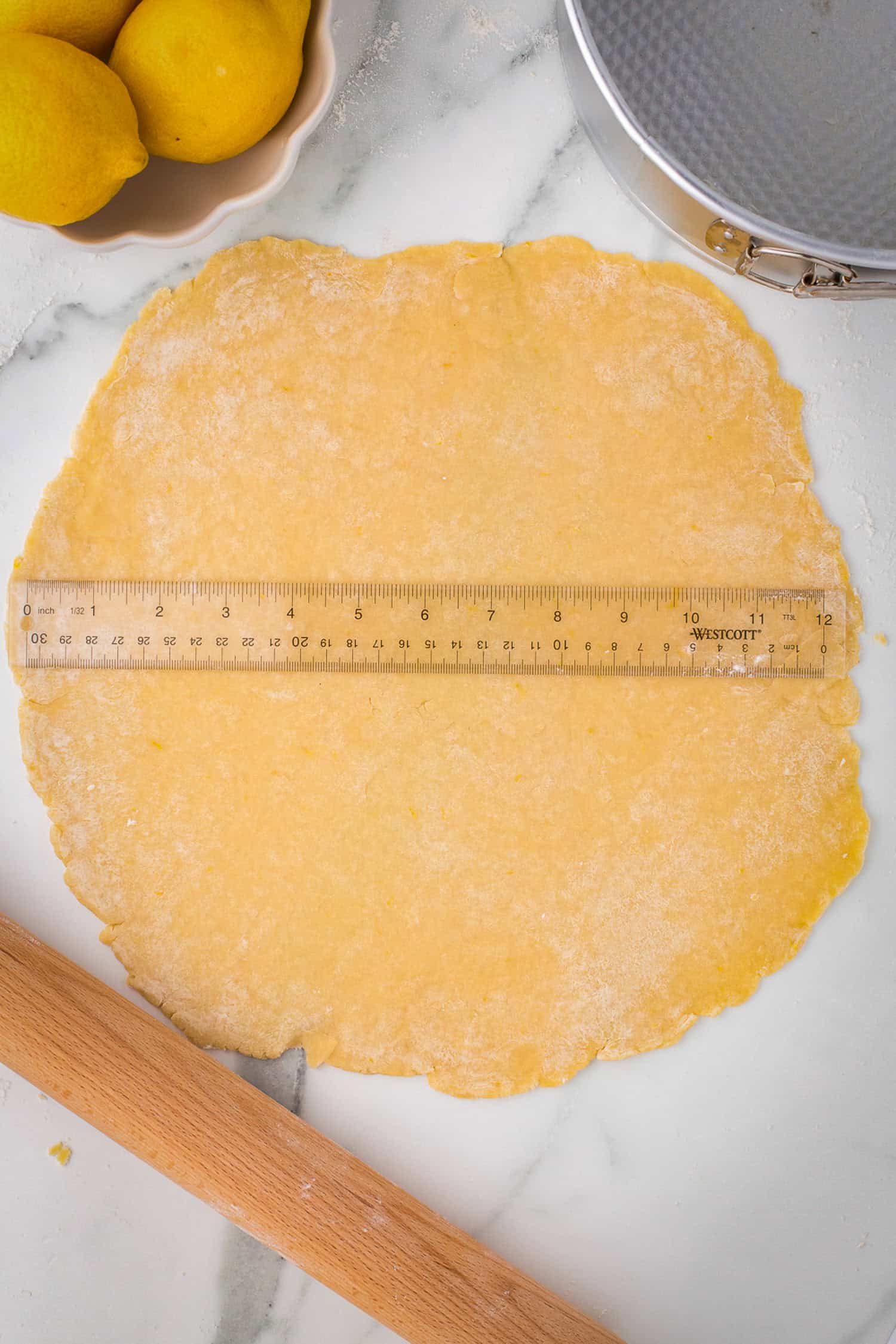 Measuring pie crust circle for size. 