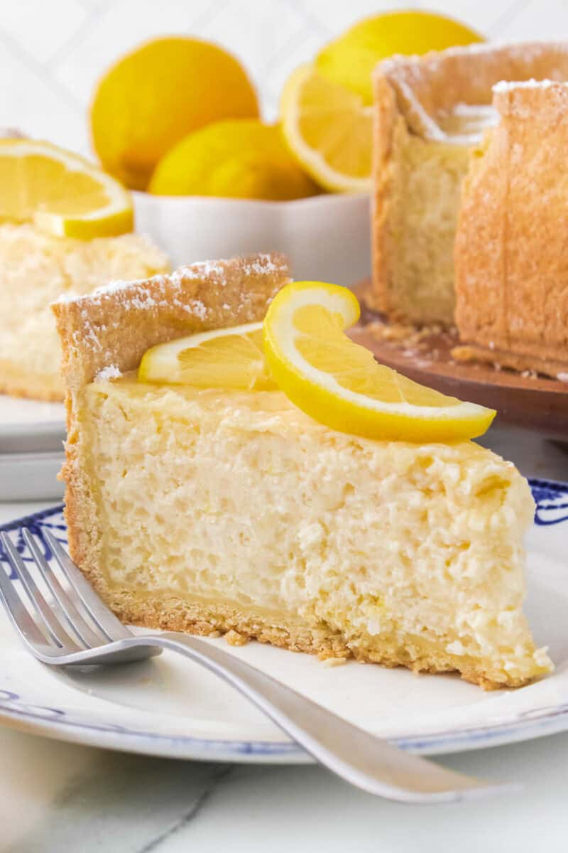 Slice of Italian rice pie on blue and white plate with fork.