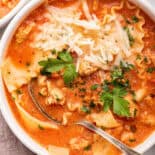 Bowl of lasagna soup with spoon in white bowl.