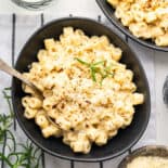 Velvety pasta with chickpeas in bowl with spoon.