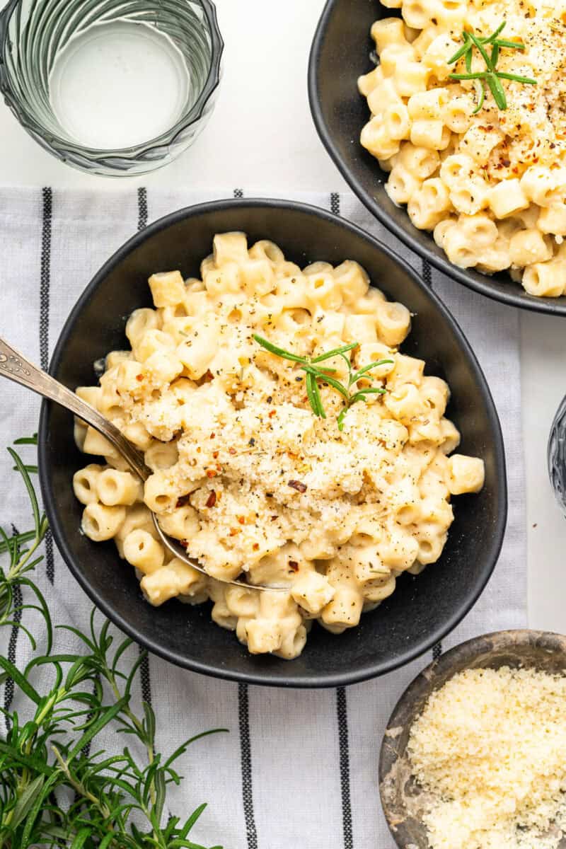 Velvety pasta with chickpeas in bowl with spoon.