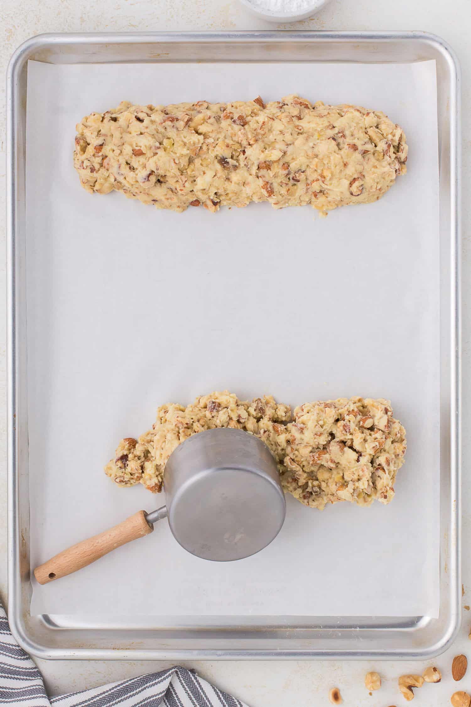 Forming the biscotti logs on a parchment lined baking tray. 