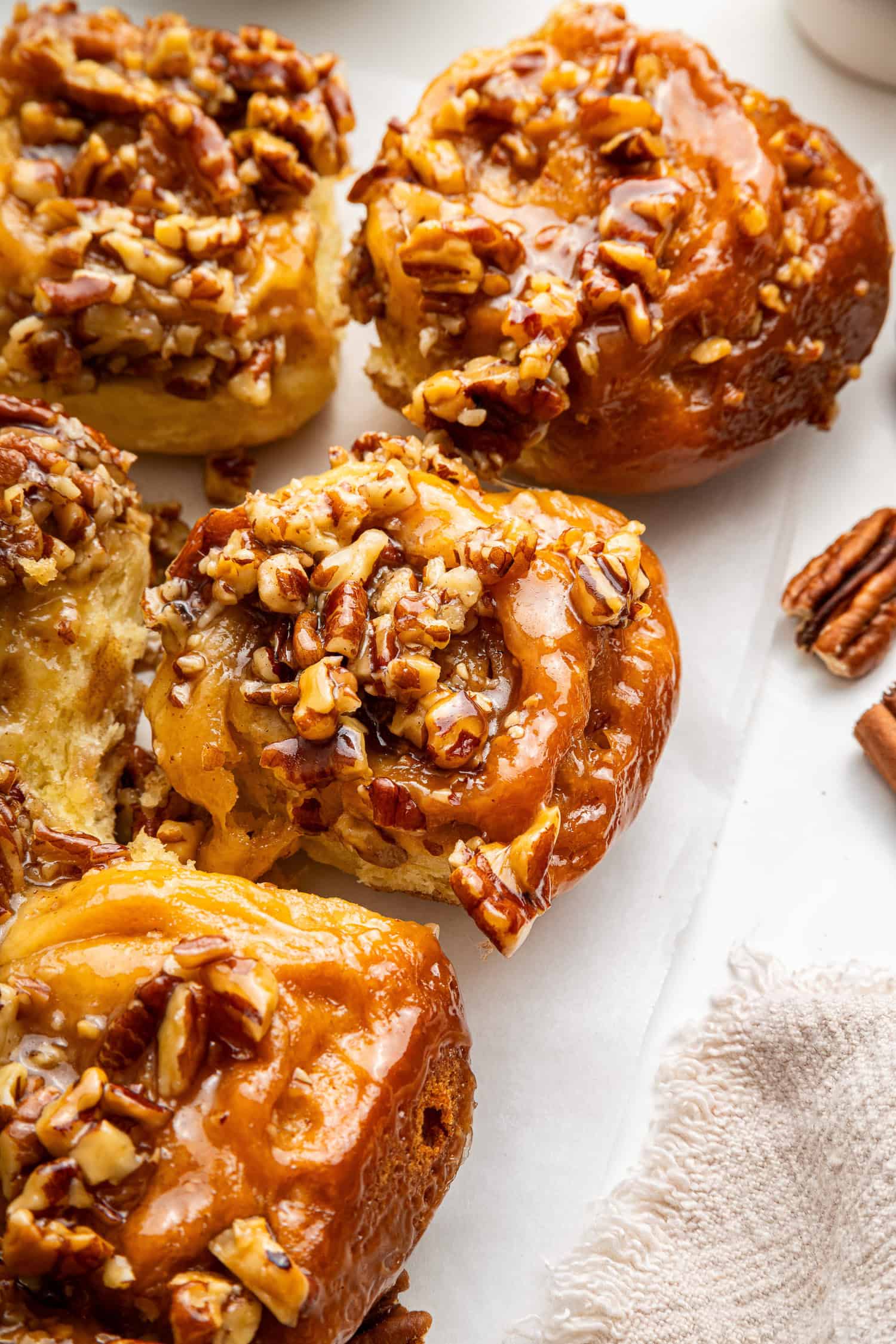 Sticky buns with cinnamon sticks.