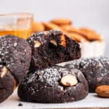 Side view of Italian chocolate cookies with nuts in background.