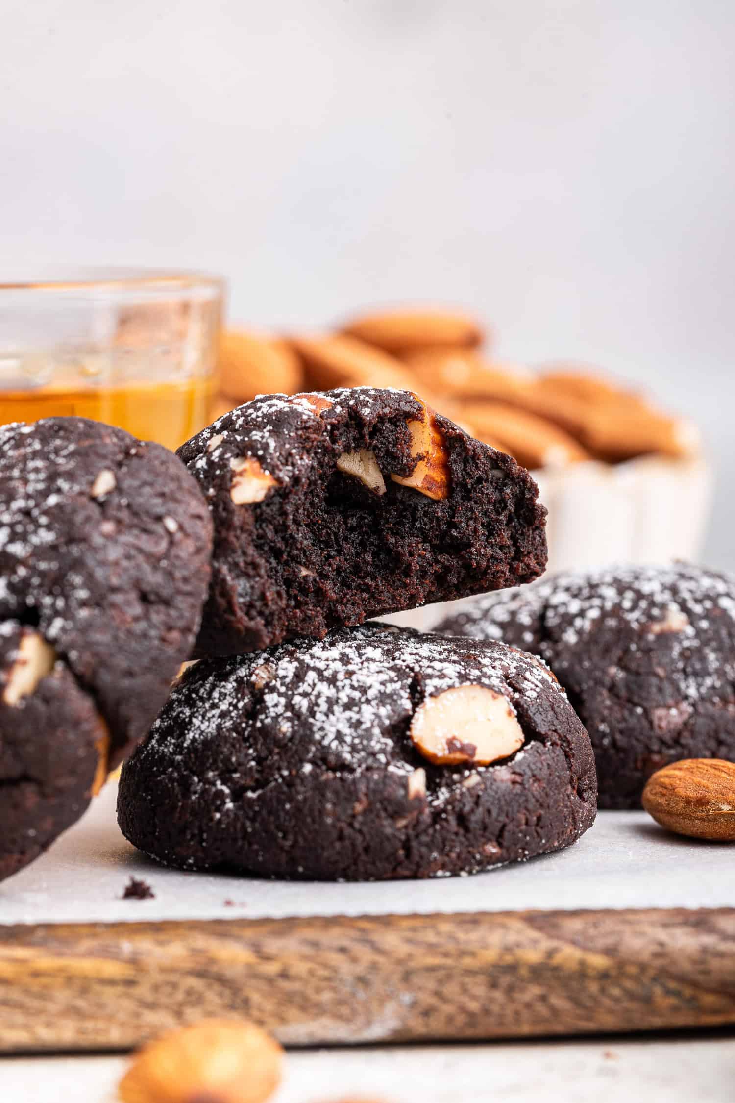 Side view of Italian chocolate cookies with nuts in background.