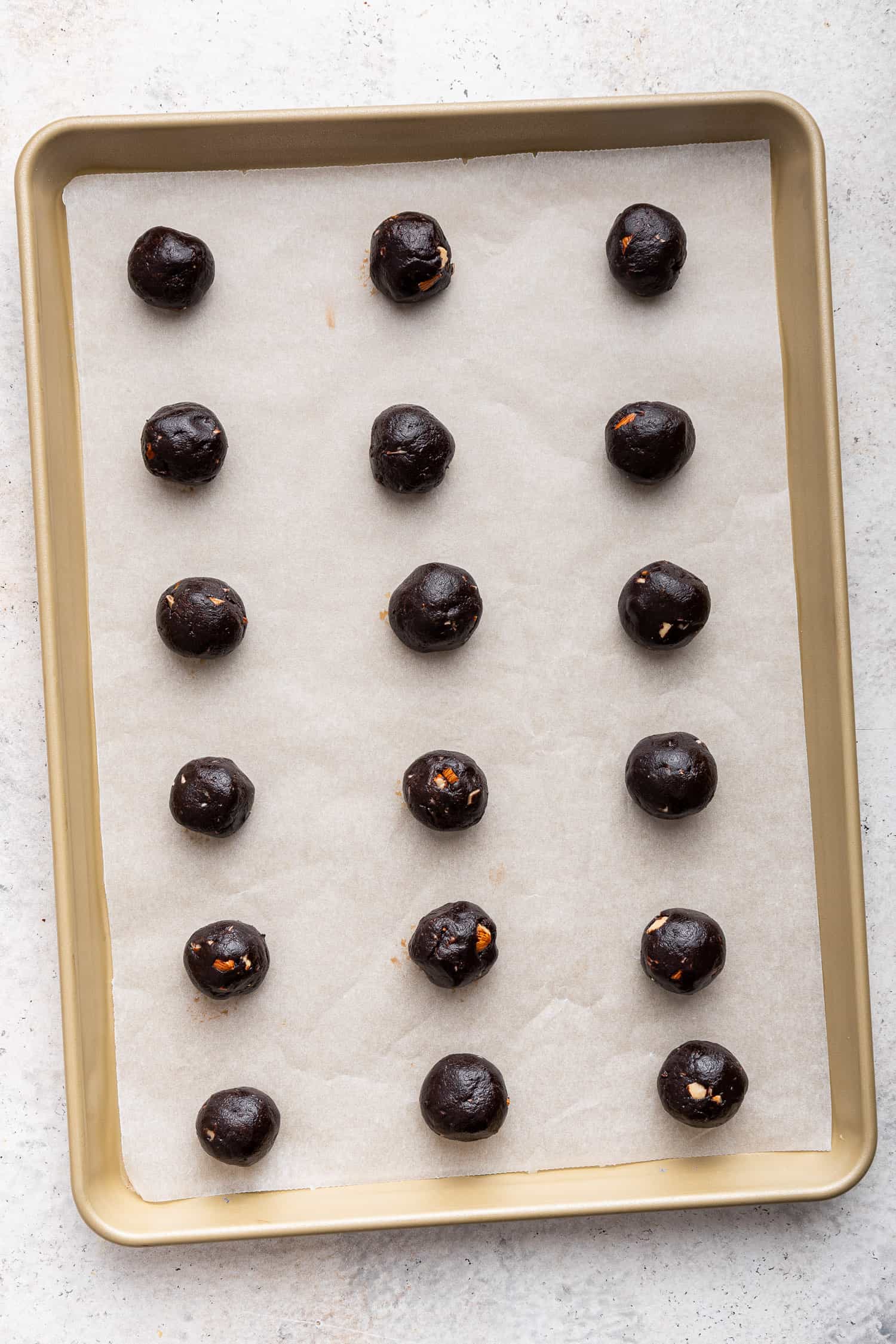 Unbaked cookies on sheet pan. 