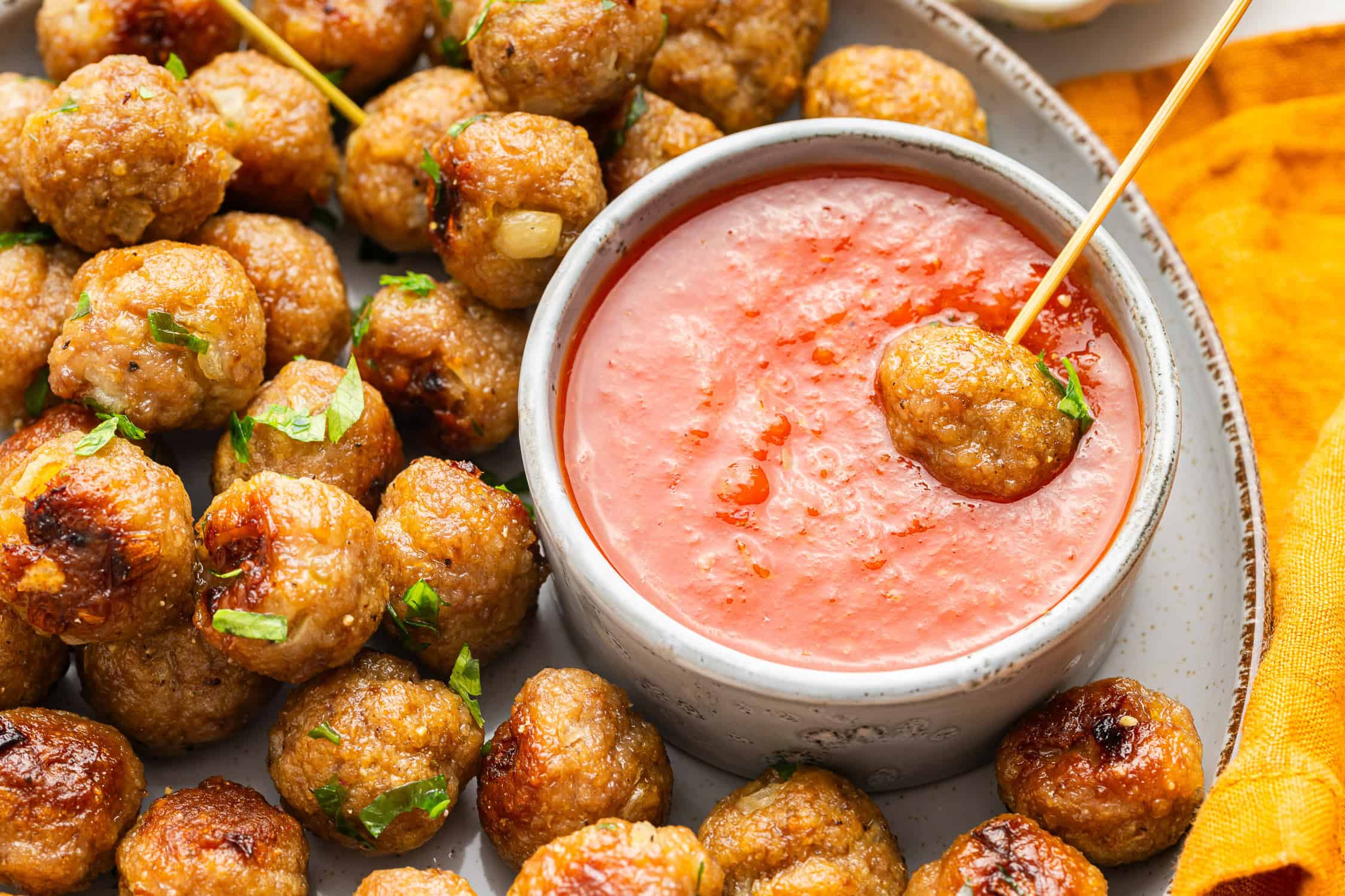 Mini meatballs with sauce in small bowl. 