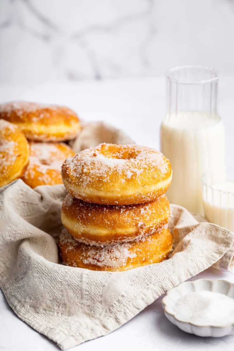 Stack of Italian potato donuts with milk.