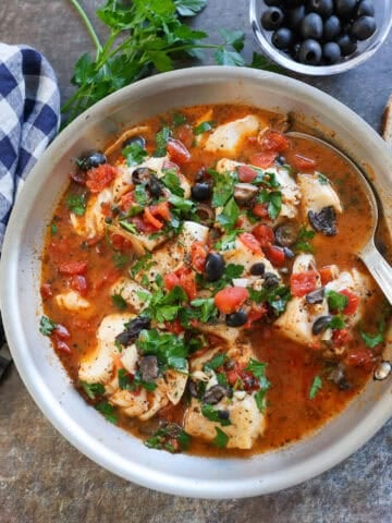 Mediterranean-style cod in pan .