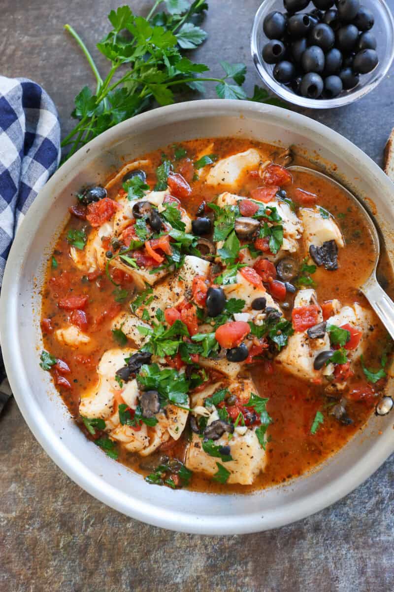 Mediterranean-style cod in pan .