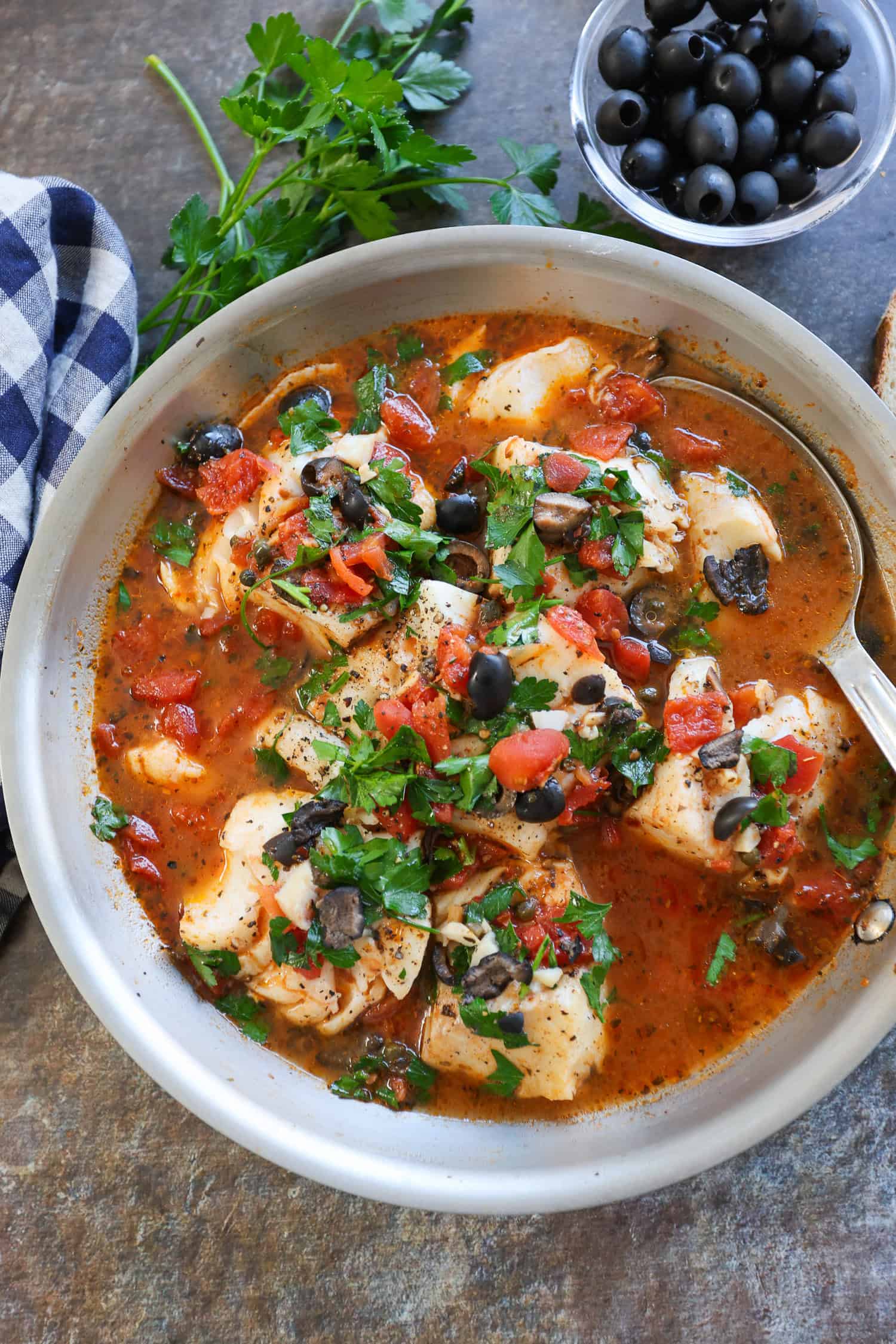 Mediterranean-style cod in pan .