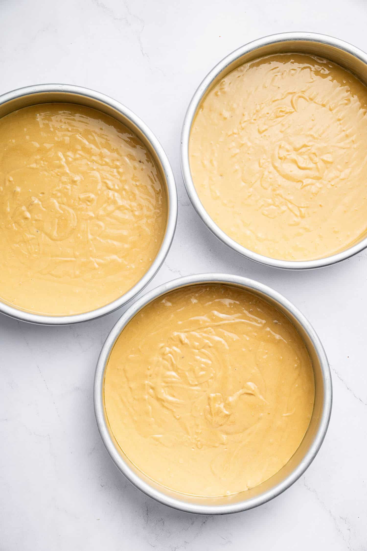 Cake pans with batter. 