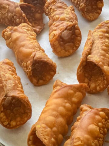 Cannoli shells on parchment.
