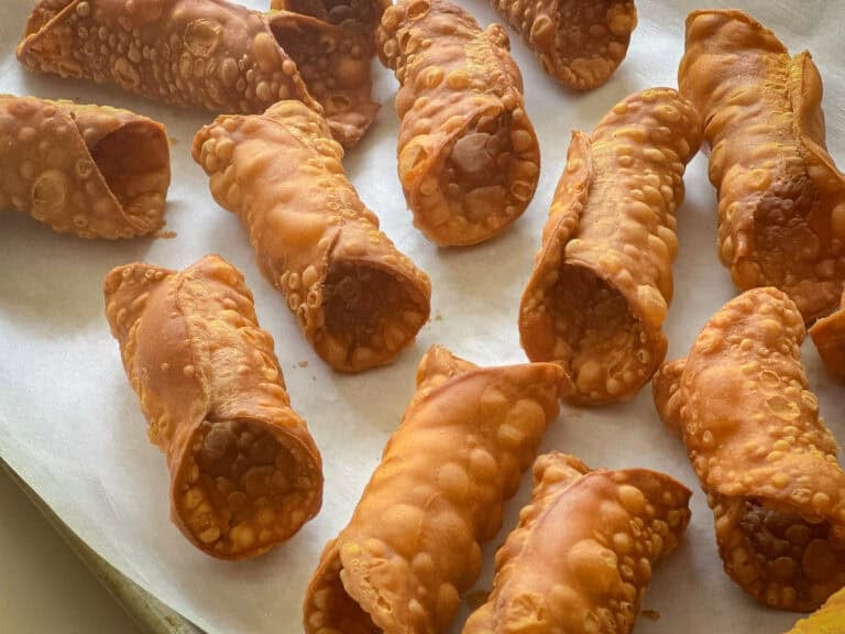 Cannoli shells on parchment.