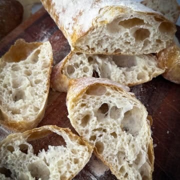 A loaf of bread on a cutting board.