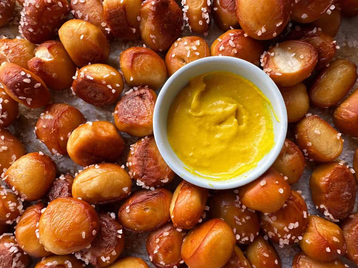 Top view of pretzel bites with small bowl of mustard.