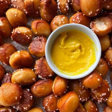 Top view of pretzel bites with small bowl of mustard.