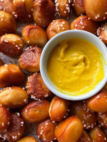 Top view of pretzel bites with small bowl of mustard.