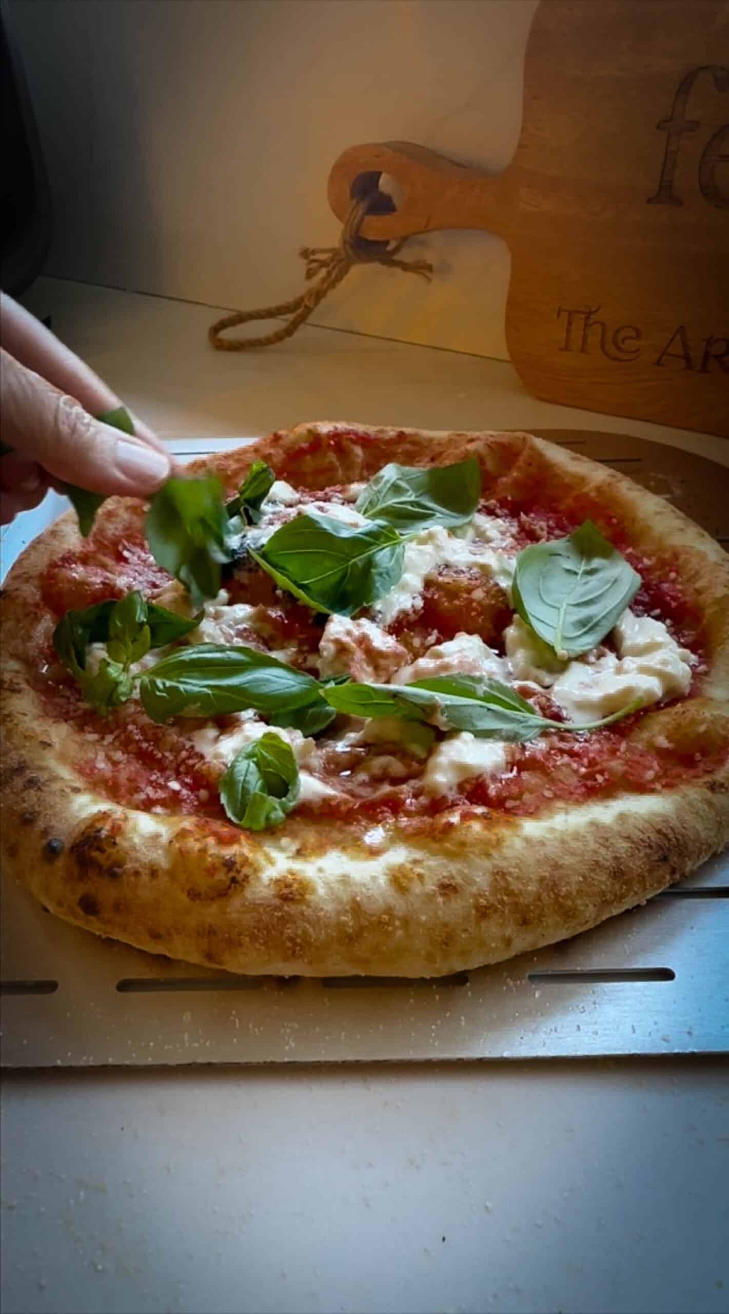 Side view of stracciatella pizza. 